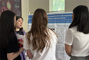 TPCB student Kristen Vogt presents a poster at the 2024 Tri-I Chemical Biology Symposium